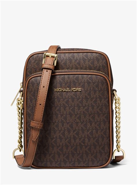 michael michael kors jet set crossbody brown logo monogram|Michael Kors flight bag.